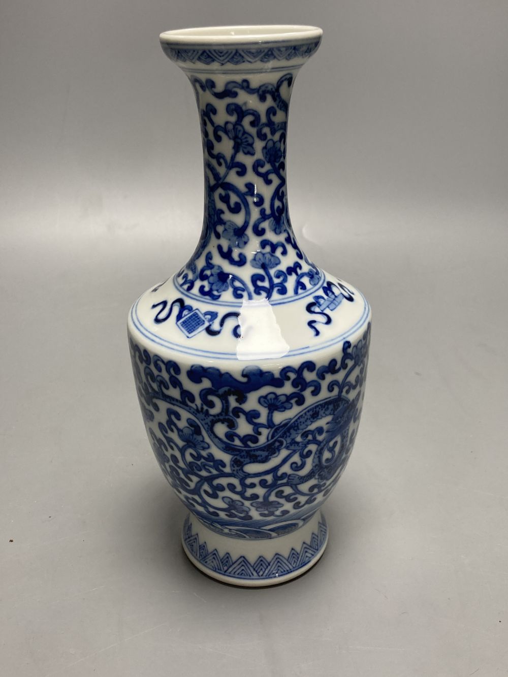 A Chinese blue and white dragon design vase, height 25cm